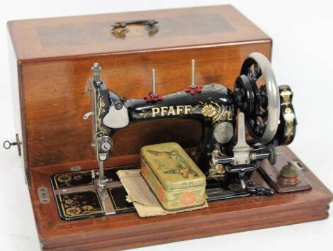 An early 20thC Pfaff walnut cased sewing machine, 47cm wide.