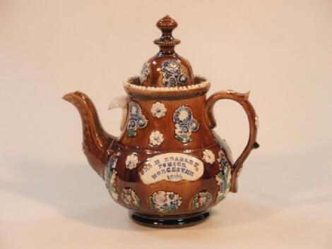 A Bargeware teapot, inscribed 'Mrs H Bradley Powick Worcester 1866', on