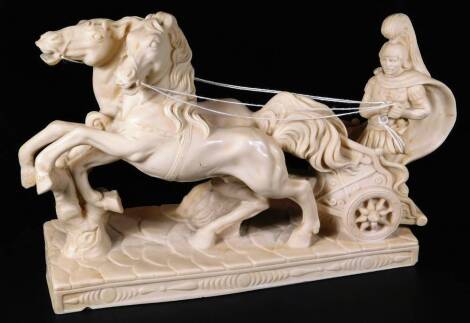 A 20thC resin figure of a chariot, being driven by two horses, with one rider, on a rectangular base, unmarked, 21cm H. Auctioneer Announce no fans in lot.