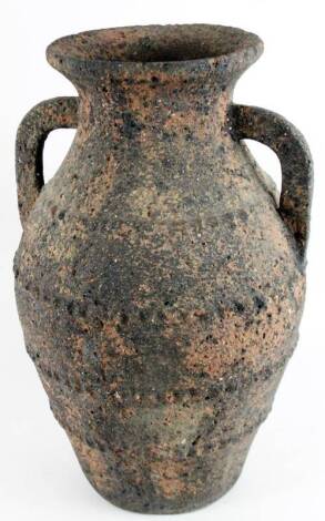 A 20thC Roman style stone vase, of shouldered circular form, with shaped handles and a partially studded body, 53cm H.