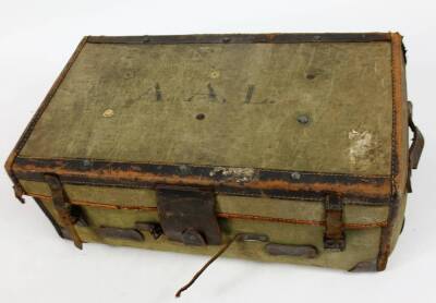 An early 20thC tin trunk, the domed top partially studded, with a plain interior, 37cm H, 55cm W, 37cm D and a travel case with stitched leather border, leather carrying handles and a pressed body initialled A A L. (2) - 2