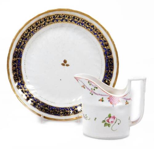 A New Hall porcelain saucer dish, of fluted form decorated with a blue band and C scroll gilding, marked pattern no. 554, 20cm Dia., and a Coalport creamer. (2 pieces)