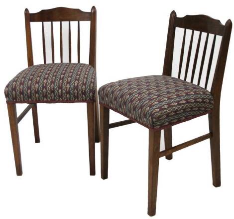 A pair of Edwardian oak dining chairs, each with horse hair overstuffed seats, each 90cm H. (2)