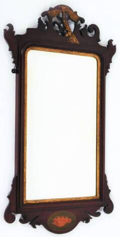 A 19thC mahogany parcel-gilt inlaid pier glass, surmounted by a ho ho bird, on a pierced background, the bevel glass in a moulded frame work, with shell patera beneath, in a heavily carved frame, 92cm H, 52cm W.