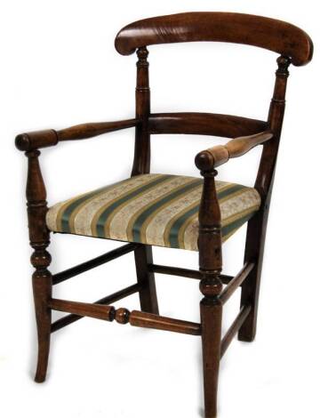 A late 19thC child’s chair, with overrun cresting rail, curved horizontal splat, turned arm supports and sabre turned front legs, 58cm H.