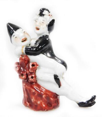 A Chinese porcelain erotic figure group