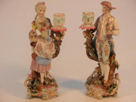 A pair of Meissen figural candlesticks