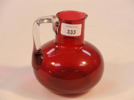 An early 20thC cranberry glass jug