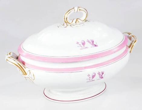 A 19thC pottery tureen, in the manner of Ridgway, the domed lid with armorial crest, set with lion flanked by gilt highlighted handles, with a similar crest to the main body, on a compressed stem and oval foot, unmarked, 27cm H.