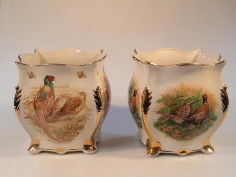 A pair of Staffordshire pottery "Flora and Fauna" jardiner?s