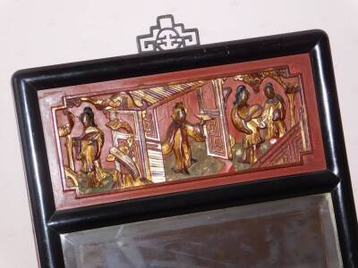 A Chinese red and black lacquer wall mirror, with relief panels and bevel plate, 80cm x 34cm. - 2