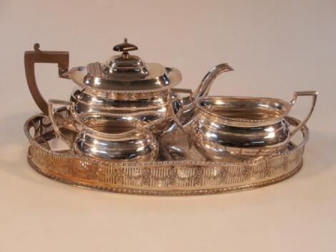 An electroplated three-piece tea service of classical form with gadroon rims