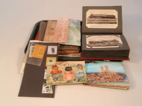 An interesting mid 20thC album of approximately sixty five postcards including