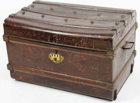 An early 20thC tin trunk, of rectangular form with a beaded lid and plain interior, 44cm H, 74cm W, 51cm D.