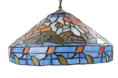 *An as new light fitting, with Tiffany style shade decorated with flowers predominately in orange and green, 35cm Dia.