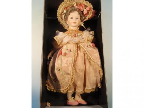 A Mundia ceramic doll 'Sophie' with certificate and box (damaged)