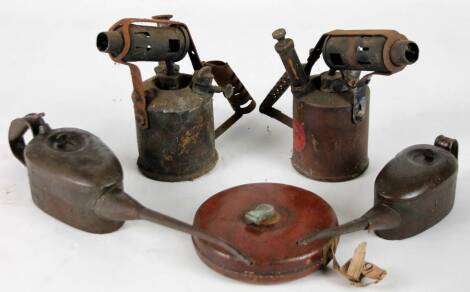 Various bygones, two early 20thC oil cans, 47cm W, two blow lamps and a leather tape measure, with articulated metal centre. (a quantity) From the estate of R J ‘Bob’ Curry (Dec’d) of Grantham.