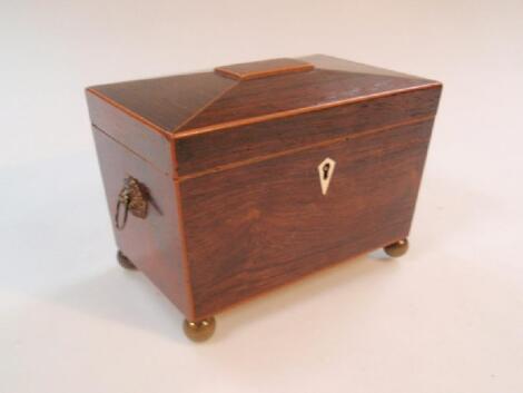 A Regency rosewood tea caddy of sarcophagus form