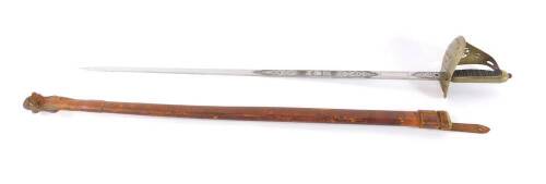 A George V 1897 pattern Infantry sword, with an etched blade and steel guard, wire bound fish skin grip, with leather scabbard, 98cm L, blade 83cm L.