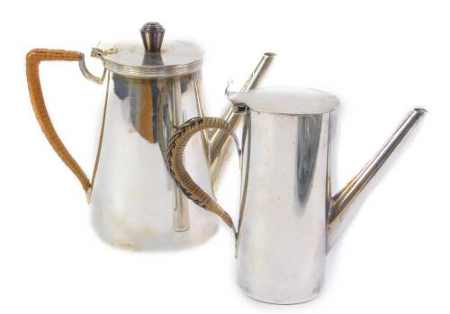 A Harrods Ltd mid 20thC silver plated coffee pot, with a hinged lid, having a brown Bakelite knop, the body of tapering form with a cane bound handle, stamped to base A.I.C. 1952, 14cm H, and a further coffee pot of similar form, 11.5cm H. (2)