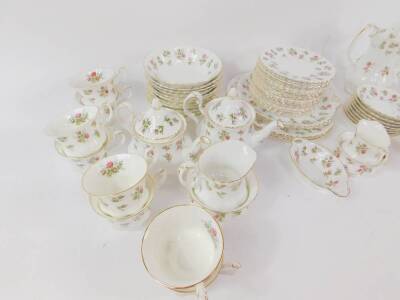 A Royal Albert porcelain tea and coffee service decorated in the Winsome pattern, comprising pair of bread plates, pair of cake plates, teapots, coffee pot, two milk jugs and cream jug, three sugar bowls, 16 cups and saucers, 18 tea plates, twin handled s - 3