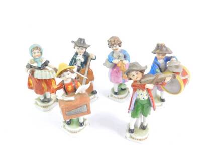 A set of six late 19thC Continental porcelain musicians, comprising a Hurdy Gurdy player, drum and cymbal player, cello player, concertina player, bagpipe player, and a violinist, 10.5cm H.