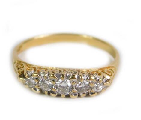 An 18ct gold and diamond five stone ring, in a Victorian style graduated setting, approx 0.3cts, size Q, 3.5g.