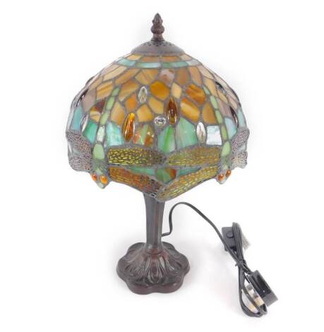 *A Tiffany style table lamp decorated in the dragonfly pattern, raised on a faux metal stemmed base, 42cm H, 25cm Dia. (boxed)