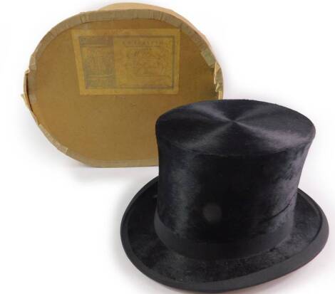 A MacQueen & Co Ltd black top hat, boxed, interior length 7 5/8, width 6 1/8.