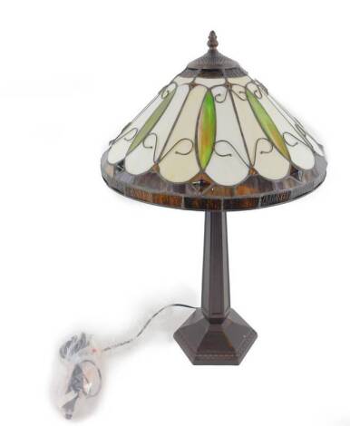 *A Minster Tiffany style table lamp, raised on a faux metal octagonal column and base, 41cm H.