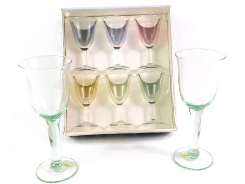 A Luminarc harlequin set of wine glasses, boxed, together with a pair of green glass goblets, 22cm H.