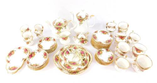 A Royal Albert porcelain part tea and coffee service, decorated in the Old Country Roses pattern, some seconds, comprising tea pot, coffee pot, cream jug, sucrier, bread plate, two tier cake stand, and single tier cake stand, twelve tea cups, saucers and