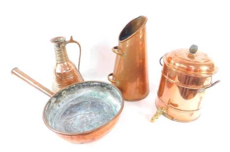 A copper tea urn with brass tap, 39cm H, copper cooking pan, 39.cm Dia., a copper coal scuttle and a Middle Eastern copper vessel with a hammered finish, 34cm H. (4)