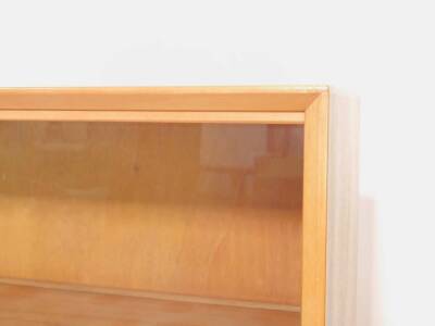 A Gibbs Furniture mahogany glazed bookcase, c1950’s, with four sliding doors, opening to reveal five shelves, raised on straight supports, bears label verso, 161.5cm H, 91cm W, 30.5cm D. - 2