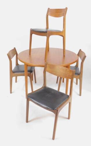 A Nils Jonsson Swedish teak extending dining table, stamped Malta, with two additional bifold leaves, raised on turned legs, 73cm H, 169.5cm W extended, 110cm D, together with four single dining chairs.