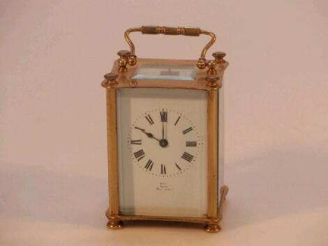 An early 20thC gilt metal carriage clock