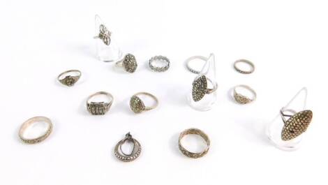 Marcasite silver and silver plated set dress rings, to include five marcasite set wedding bands, a single marcasite set drop earring, and eight marcasite set elaborate dress rings of varying design. (qty)