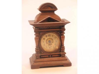 A Black Forest walnut cased bracket clock