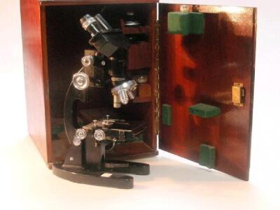 A mahogany cased binocular microscope by Cooke Troughton & Simms