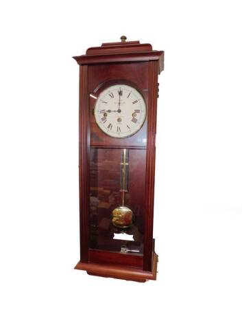 A Sewills mahogany cased wall clock, circular dial bearing Roman numerals, eight day movement with Westminster chimes, the case of plain form, with key, 74cm H.