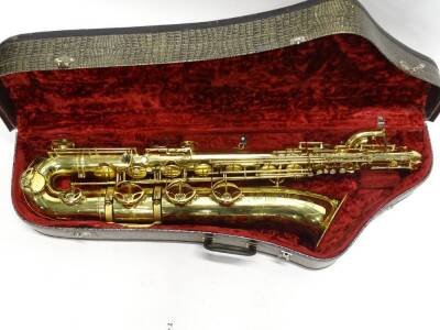 A Selmer brass baritone saxophone to low A, engraved Selmer, Made In France, with registration letter, number 131713, 100cm H. - 2