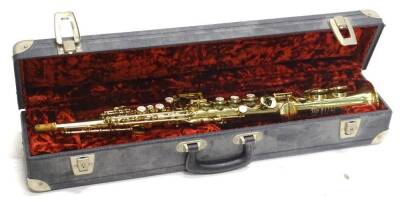 A Selmer brass effect soprano saxophone, number 186907, in fitted case. Auctioneer announce - this is a soprano saxophone and not a clarinet.