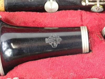 A Le Blanc black Bakelite or plastic clarinet, in various pieces with accessories etc., and a fitted case. - 2