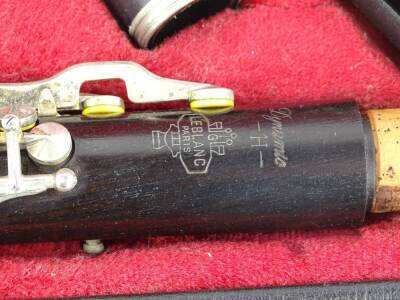 A Le Blanc black Bakelite or plastic clarinet, in various pieces with accessories etc., and a fitted case. - 3