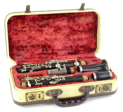 A Selmer Sterling black Bakelite or plastic clarinet, with plated mounts and various pieces in a fitted case.