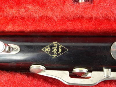 A Noblet of Paris black Bakelite or plastic bass clarinet, with plated mounts, in a fitted case. - 2