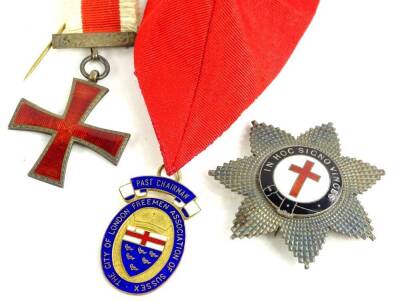 Two Knights Templar related silver and enamel jewels or medals, one star form, bearing the Latin motto, In Hoc Signo Vinces, the other a red cross with a red and cream strapped ribbon, and a silver gilt city of London Freeman association of Sussex past ch