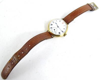 A gentleman's wristwatch, with circular white enamel dial watch head, with seconds dial blue hands, in 18ct gold case, marked to interior maker A.G.R, numbered 315646, with a 15 jewel Swiss movement on brown leather strap. - 2