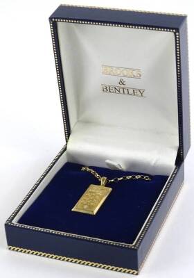 A Brooks and Bentley 9ct gold ingot pendant and chain, the pendant set with crown and three lions and tiny white stone to bottom, on a curb link 9ct gold chain, 9.1g all in. - 2