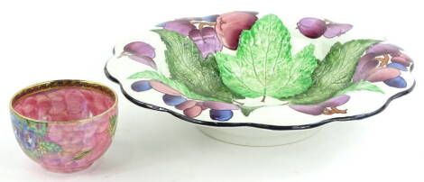 A Burleigh ware dish, decorated with fruit and leaves by Charlotte Rhead, and a small Maling lustre bowl, 31cm and 11cm diameter.